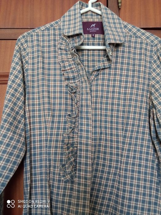 Camisa como nova Sacoor