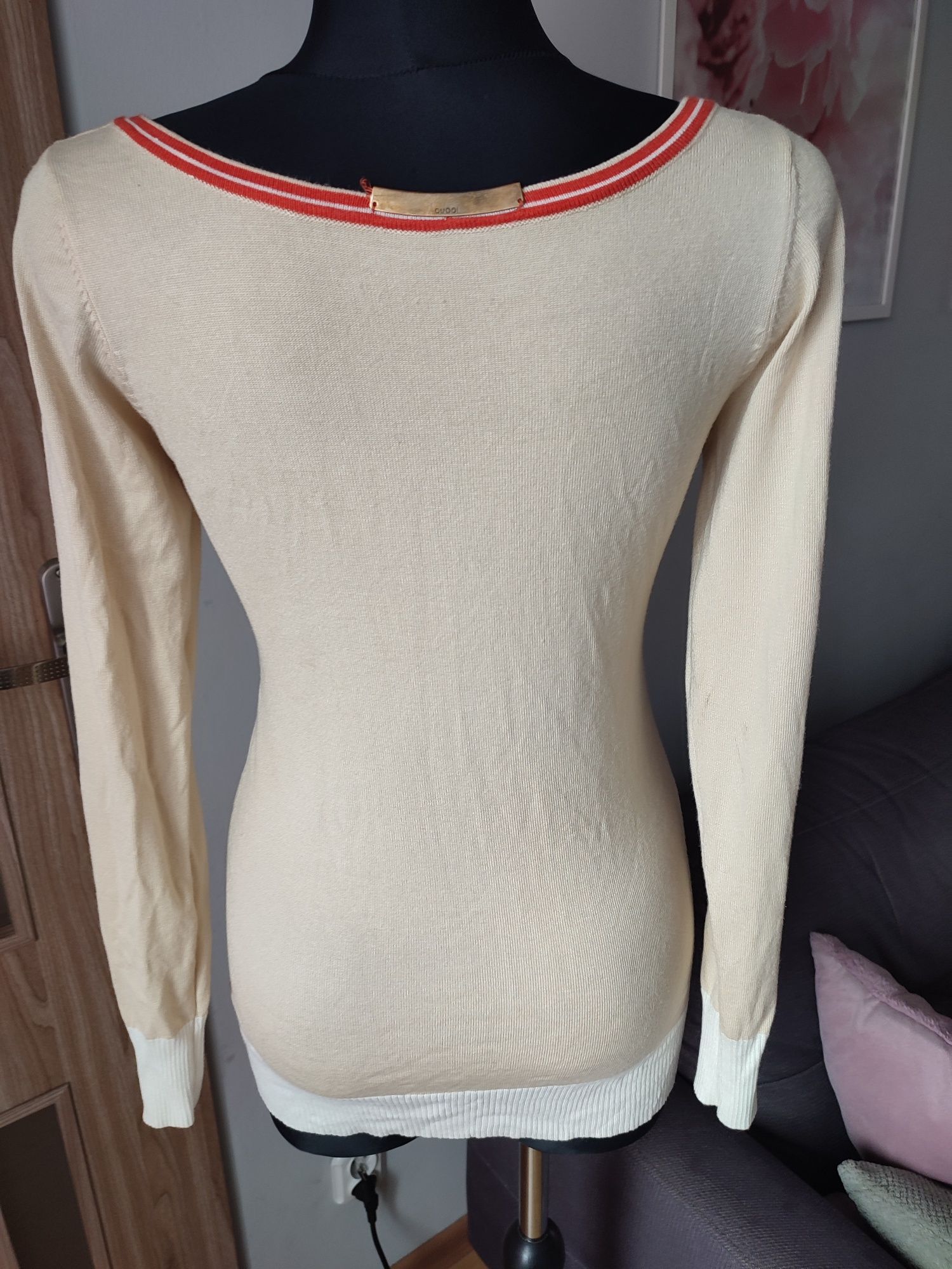 Sweterek z kokardą rozmiar L/XL