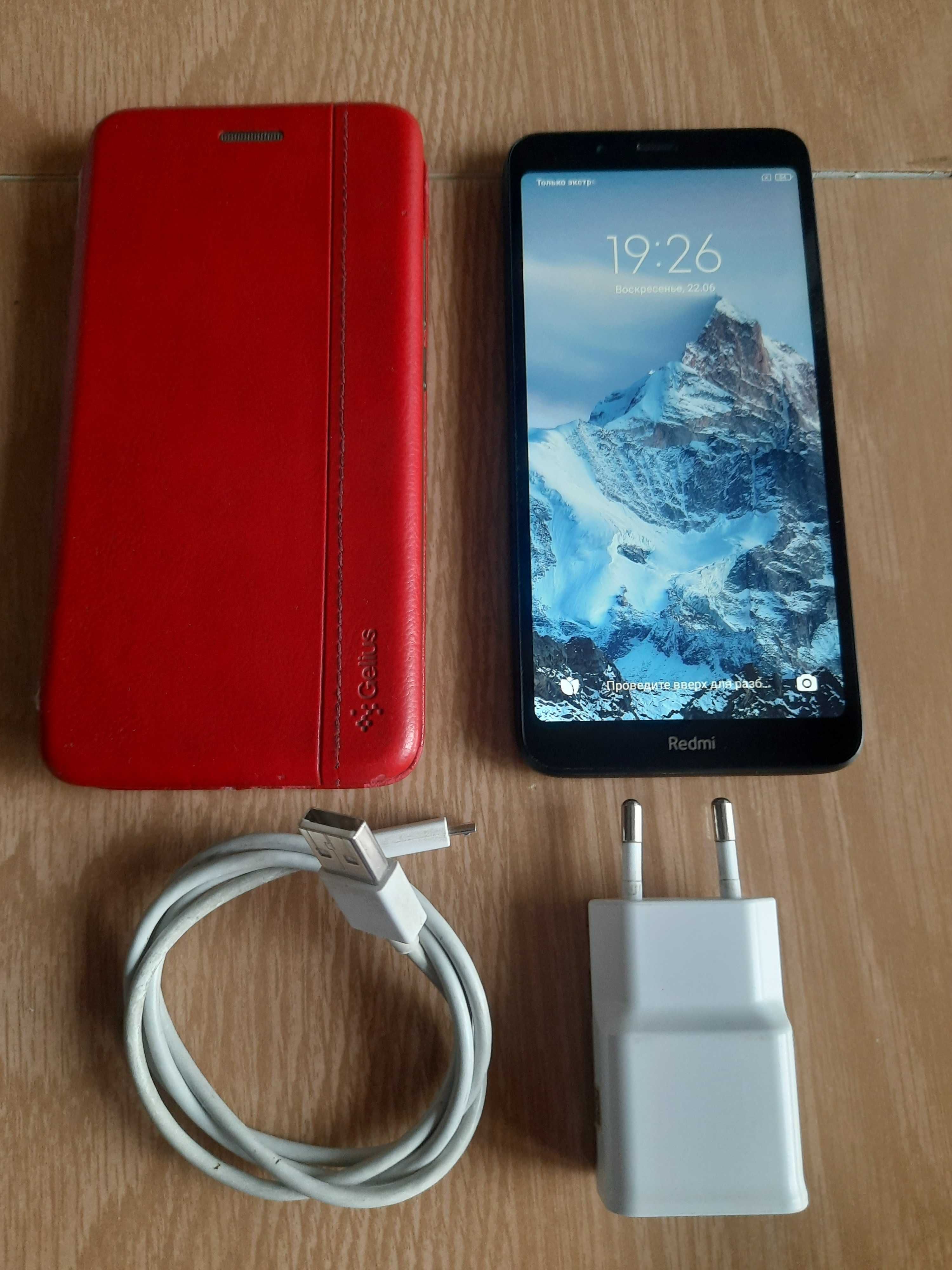 Телефон Xiaomi Redmi 7a черного цвета + чехол + зарядное.