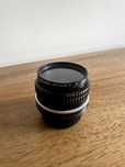 Obiektyw Nikon Nikkor 50mm f/1.8 + filter Promaster Spectrum 7 UV 52mm