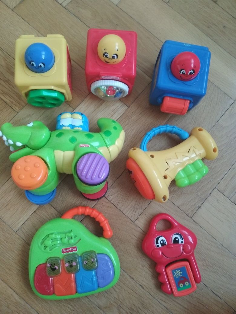 Zabawki Fisher Price pchacz krokodyl,grające pianinko, trąbka i klock