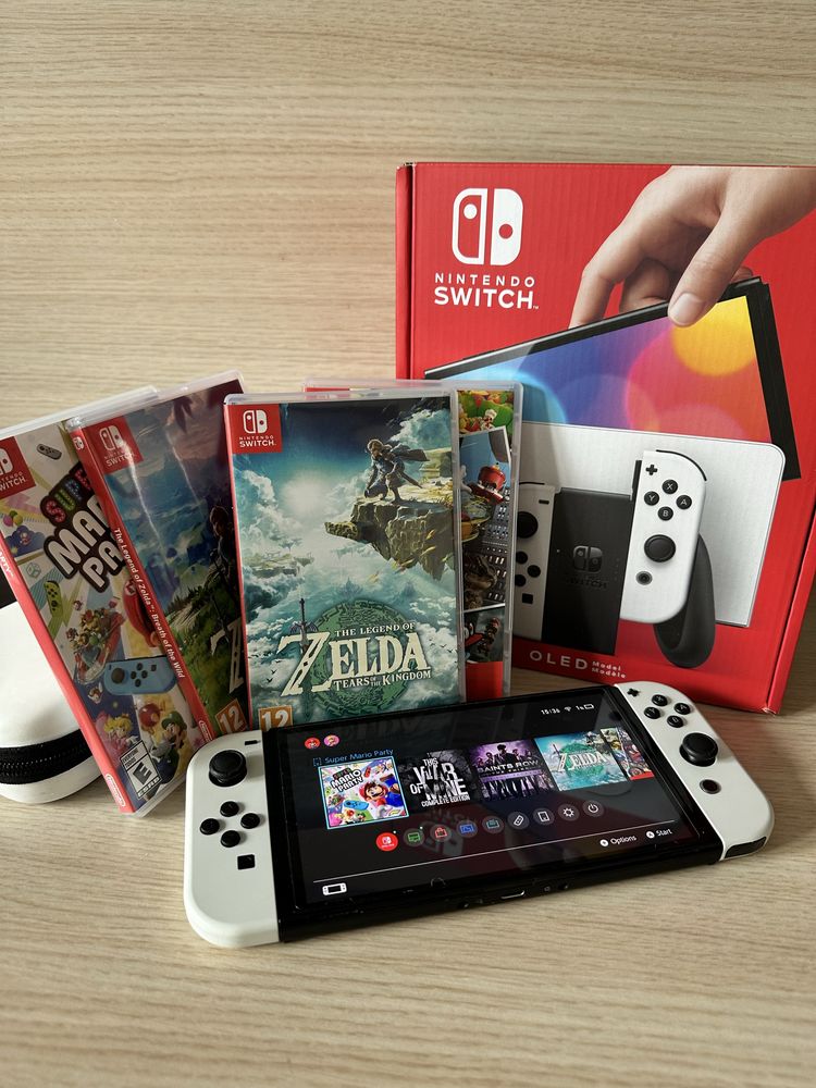 Nintendo Switch OLED biały + 4 gry na kartridżach + etui. Stan idealny