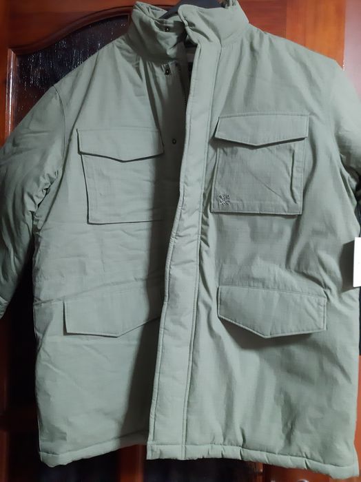 Куртка нова.Болотного кольору.