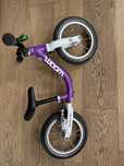 Woom 1 12 cali fiolet  biegowy