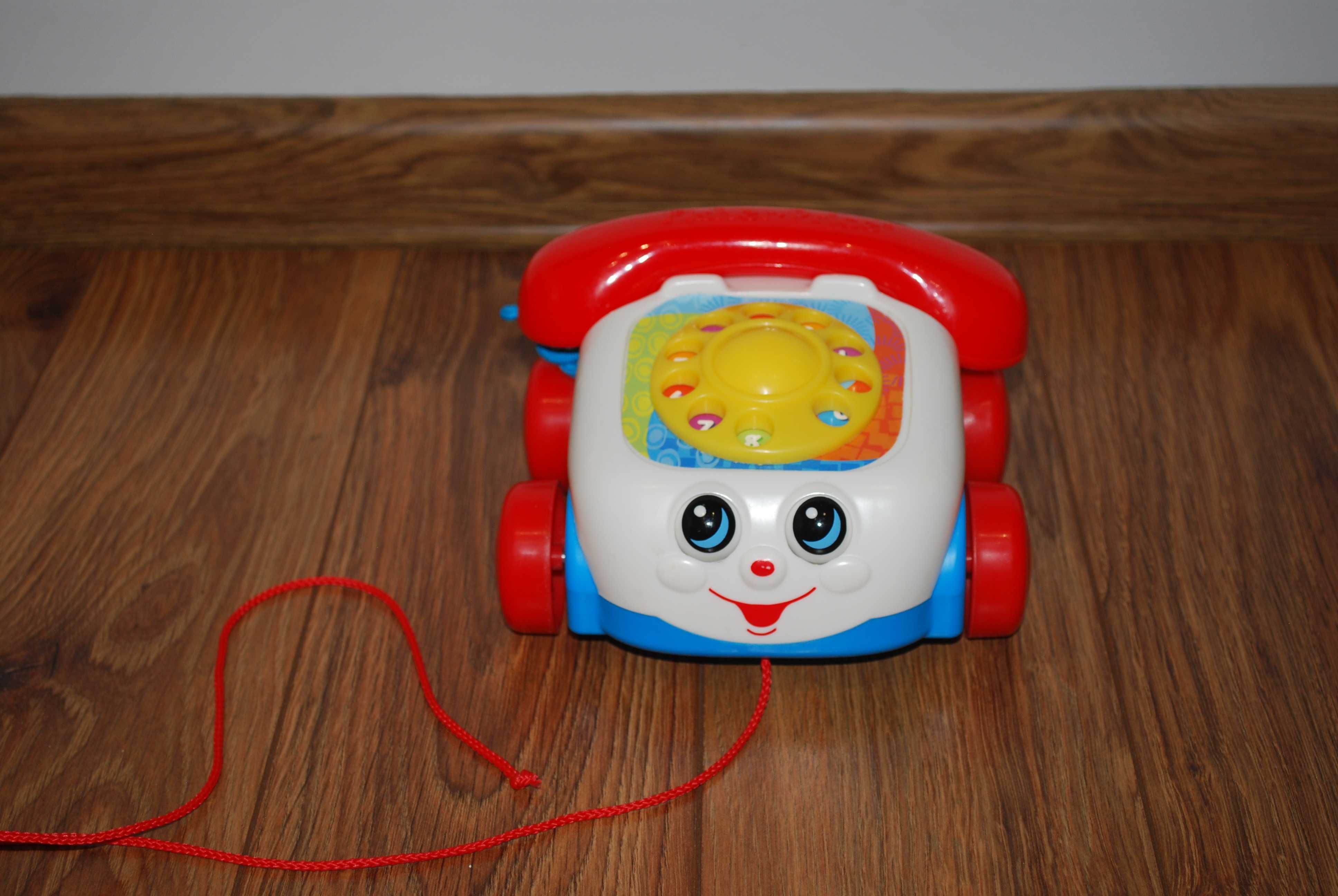 Fisher Price - jeżdżący telefon z oczkami