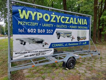 Przyczepa reklamowa Baner Wynajem przyczep reklama mobilna lawety moto