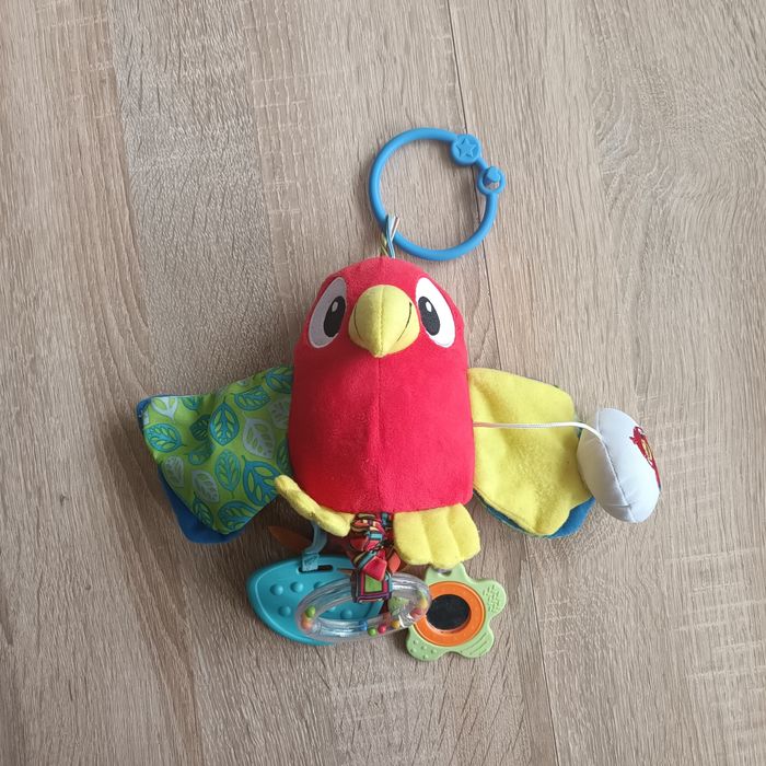 Papuga Smily Play Mali Kumple zabawka niemowlęca wibrująca zawieszka