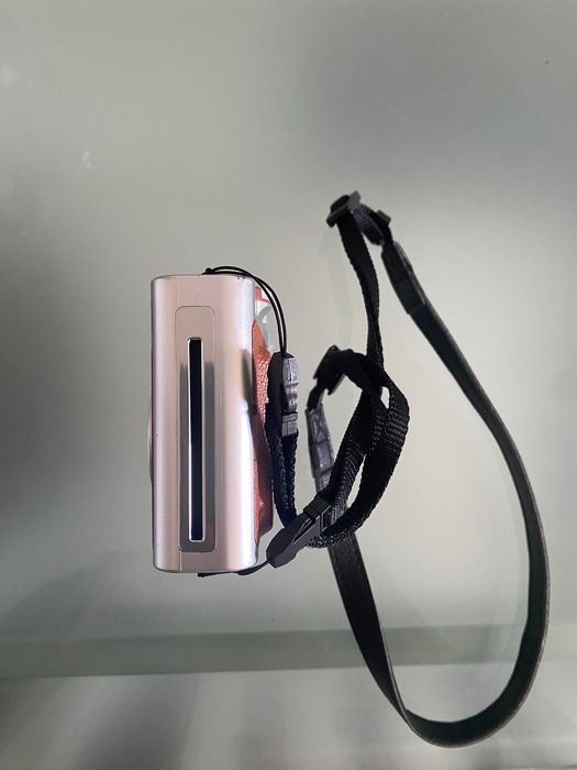 Máquina fotográfica fujifilm instax mini evo e capa.