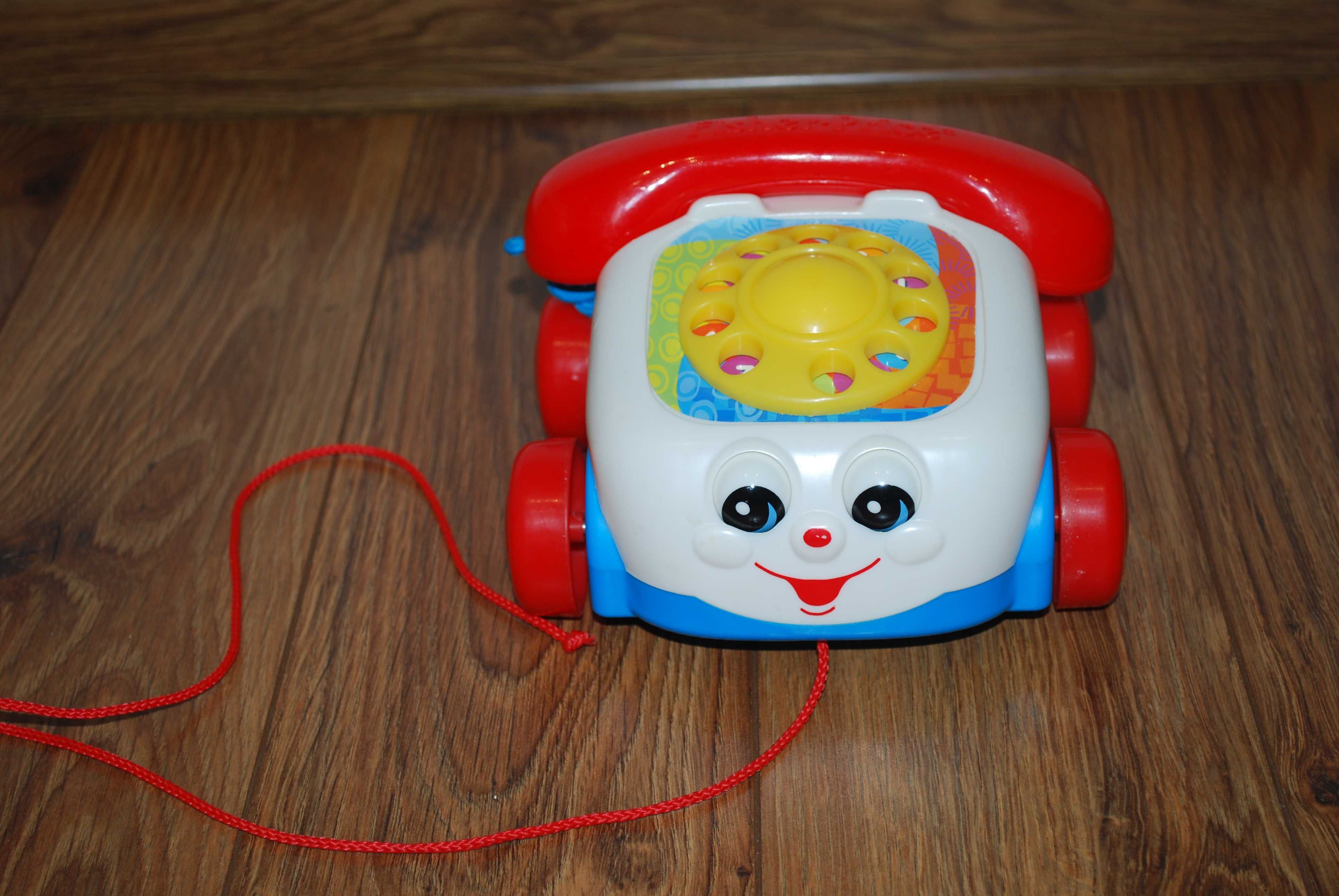 Fisher Price - jeżdżący telefon z oczkami