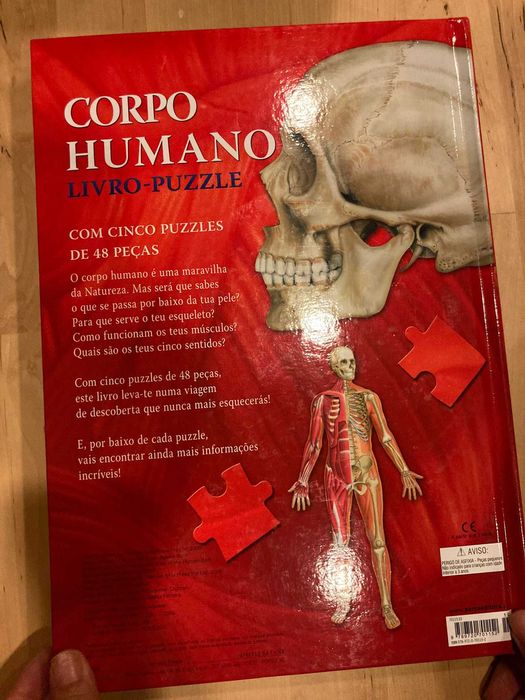 Livro puzzle anatomia corpo humano contem varios puzzles por abrirl.
