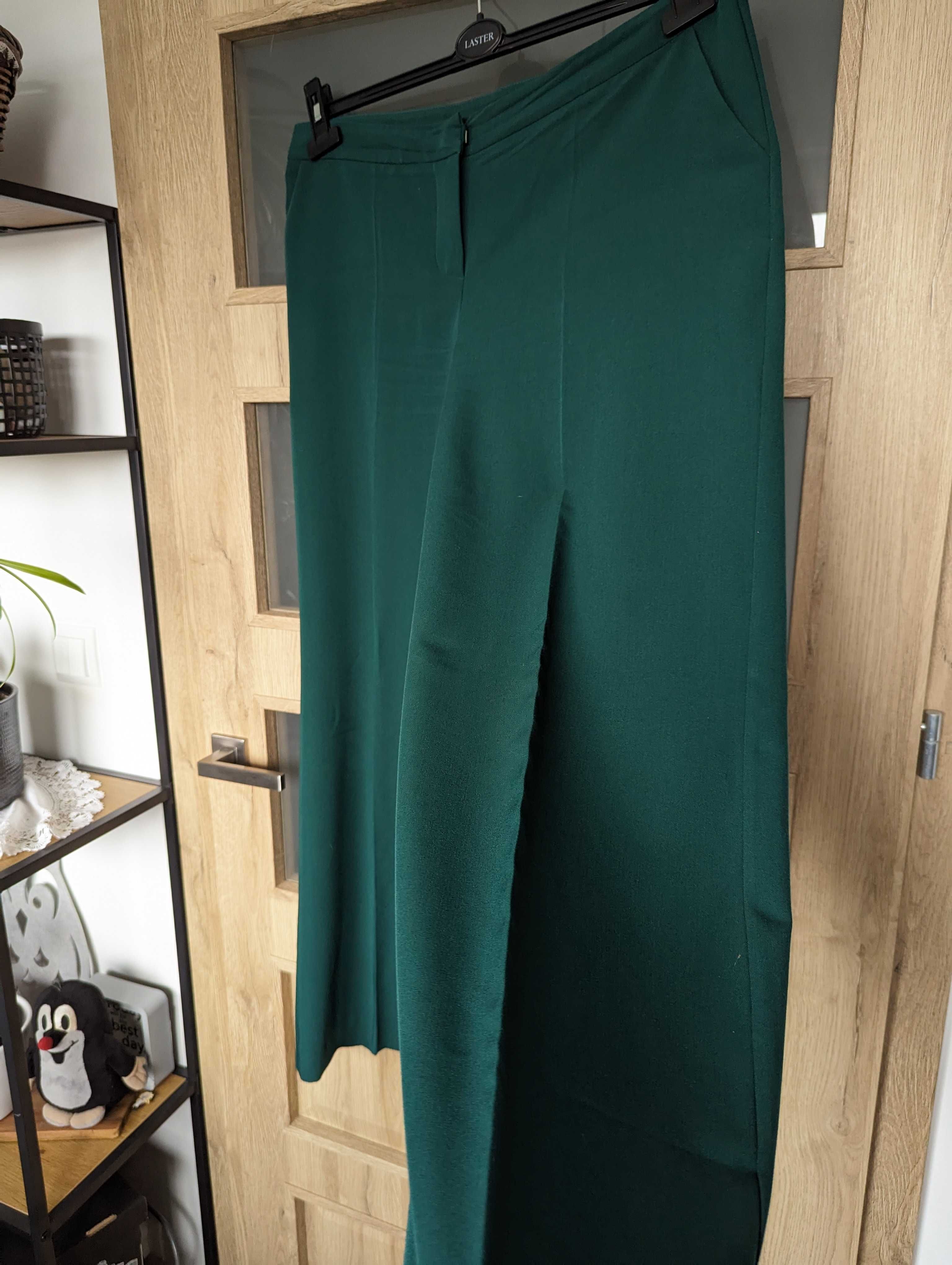 Spodnie z szerokimi nogawkami na kant butelkowa zieleń rozm. 42/XL