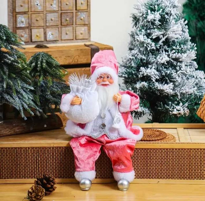 Dekoracja świąteczna - siedzący różowy Święty Mikołaj
