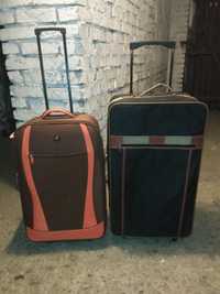 dwie torby podróżne na kółkach