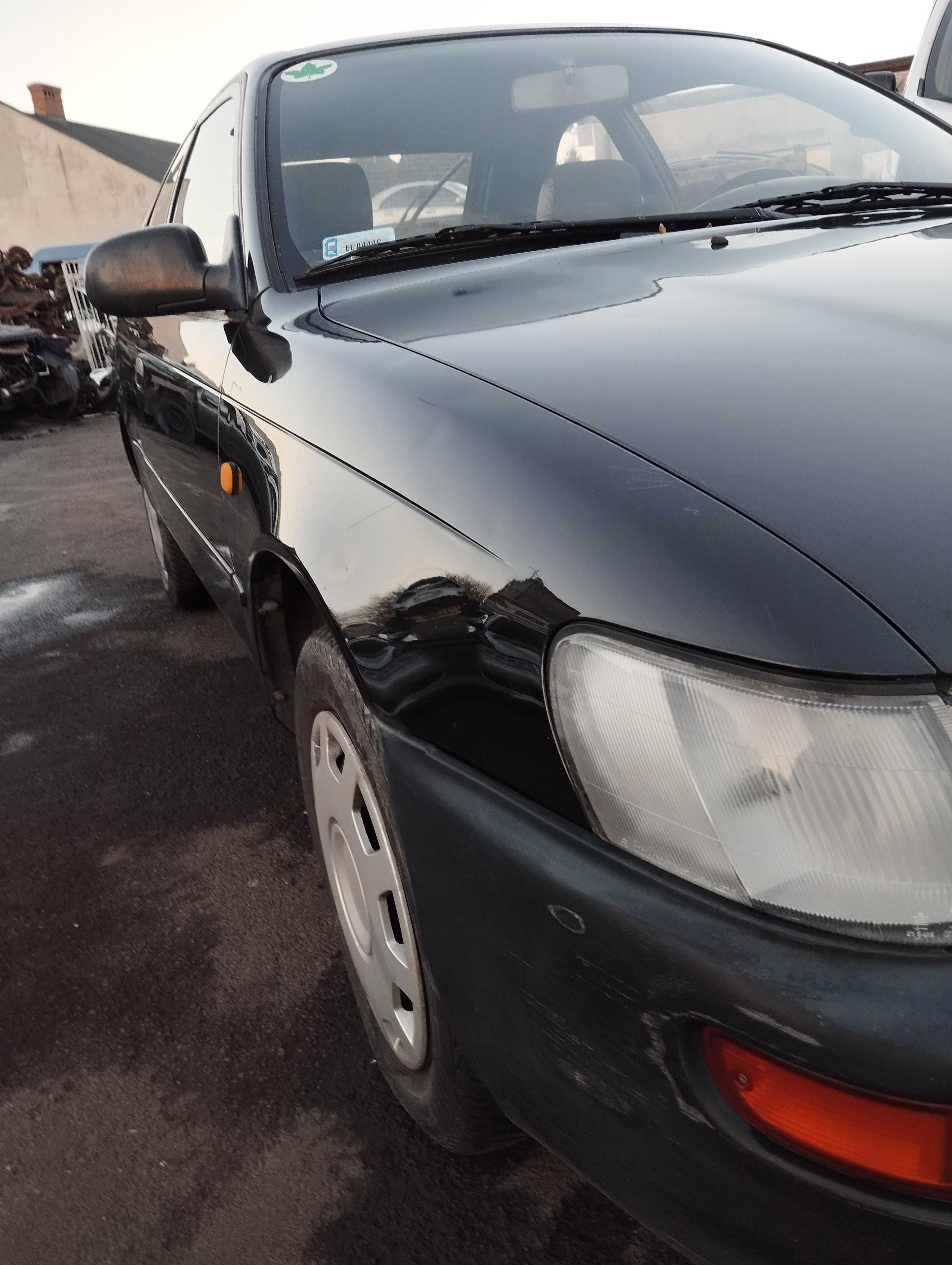 Toyota Corolla AE100 1.4i 3D 1996r.Błotnik przedni prawy.