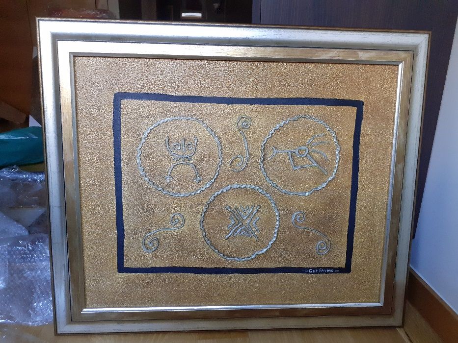 Tela pintada com moldura prateada e dourada