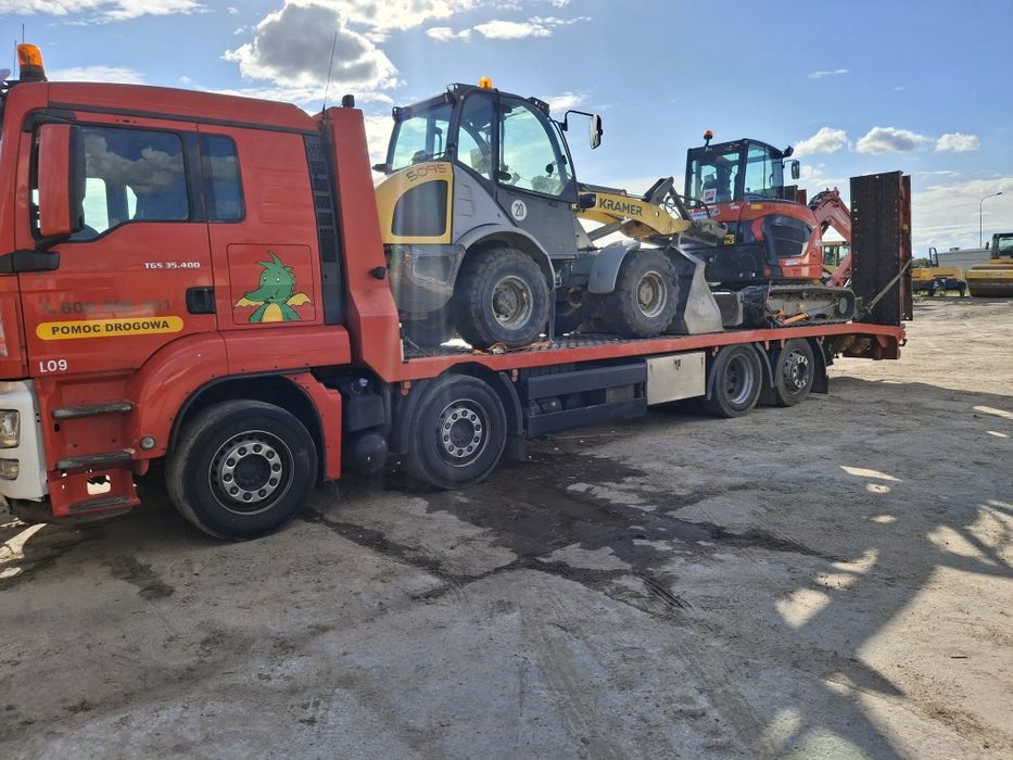 Laweta transport pomoc drogowa koparka ładowarka wozek widłowy bus