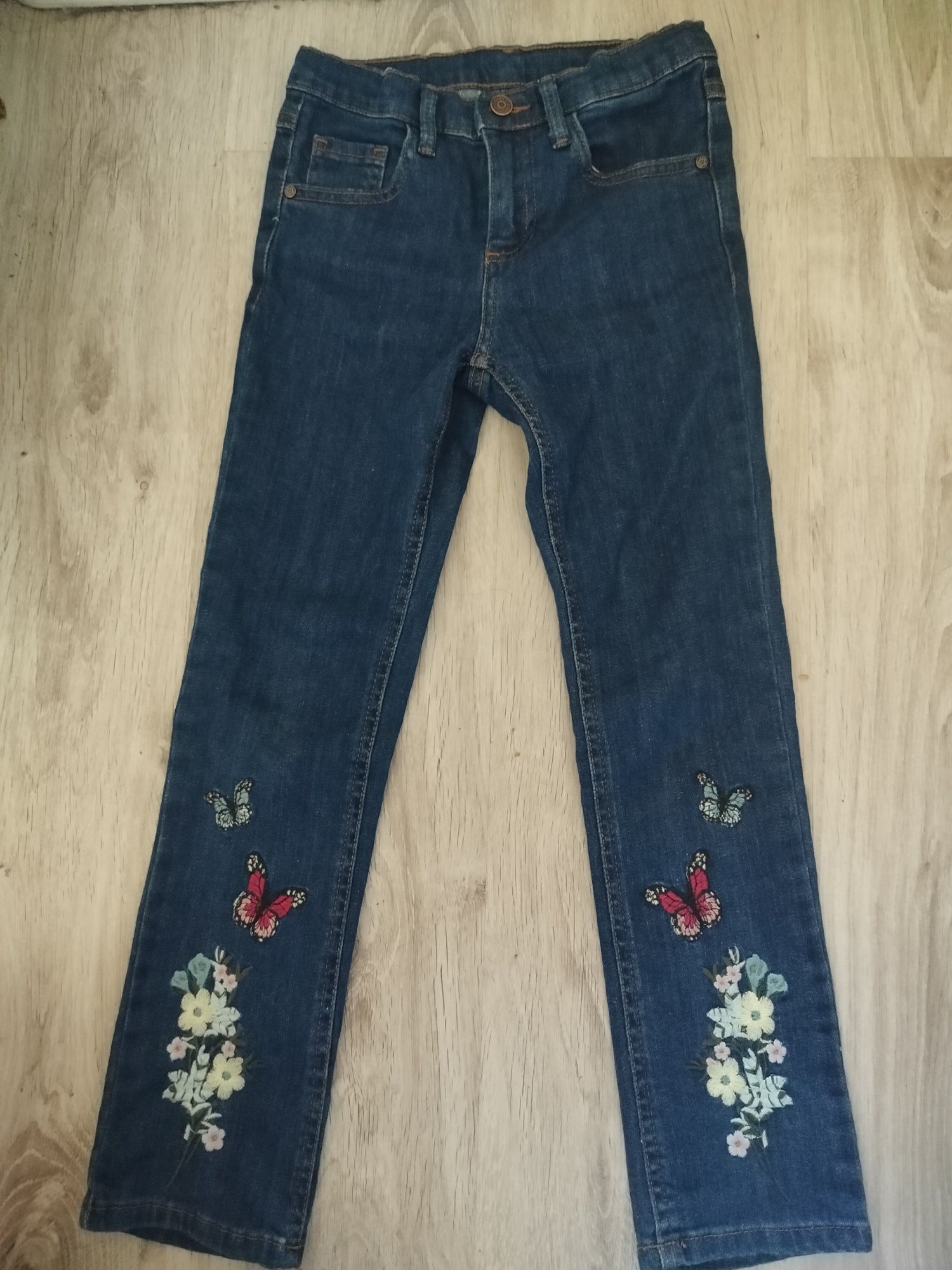 Spodnie dziewczęce jeansowe Reserved kwiatki motylki 128 134