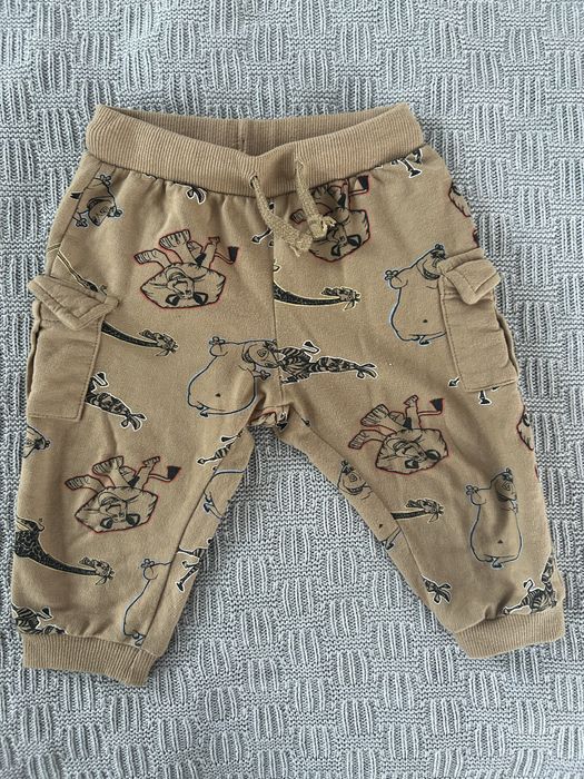 Beżowe/brązowe  spodnie w zwierzęta 80 cm,