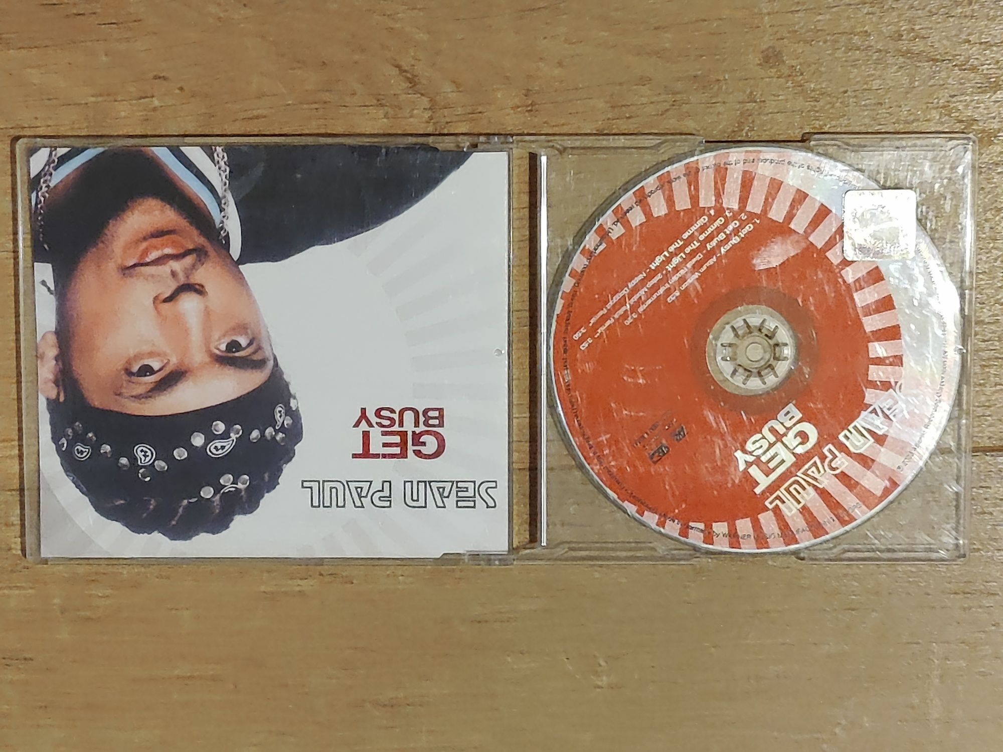 Sean Paul - Get Busy;  Ja Rule -  Pain is Love CD