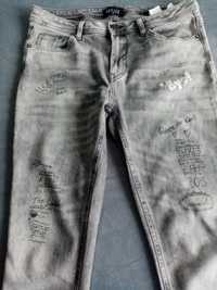 Spodnie damskie jeansowe Mohito