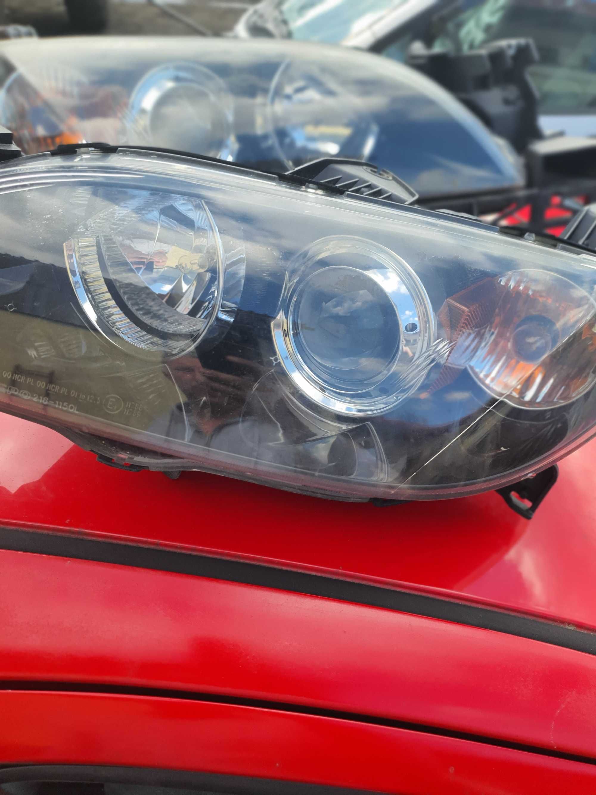 Reflektor lewy Mazda 3 bk