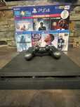 Ps4 com um comando e 4 jogos 1TB de memoria