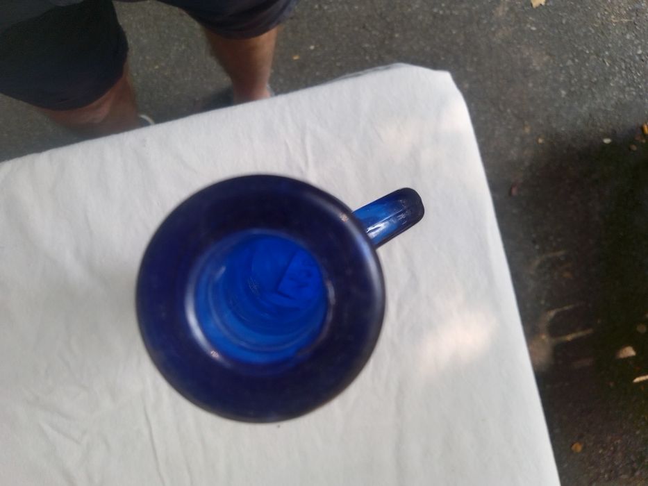 Navy blue trumpet-shaped bottle.64284843763074122