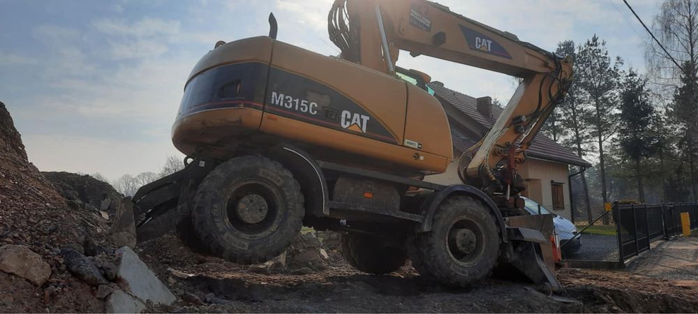 Koparka kołowa obrotowa CAT M315 C rototilt