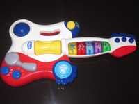Музыкальная игрушка Гитара Chicco.