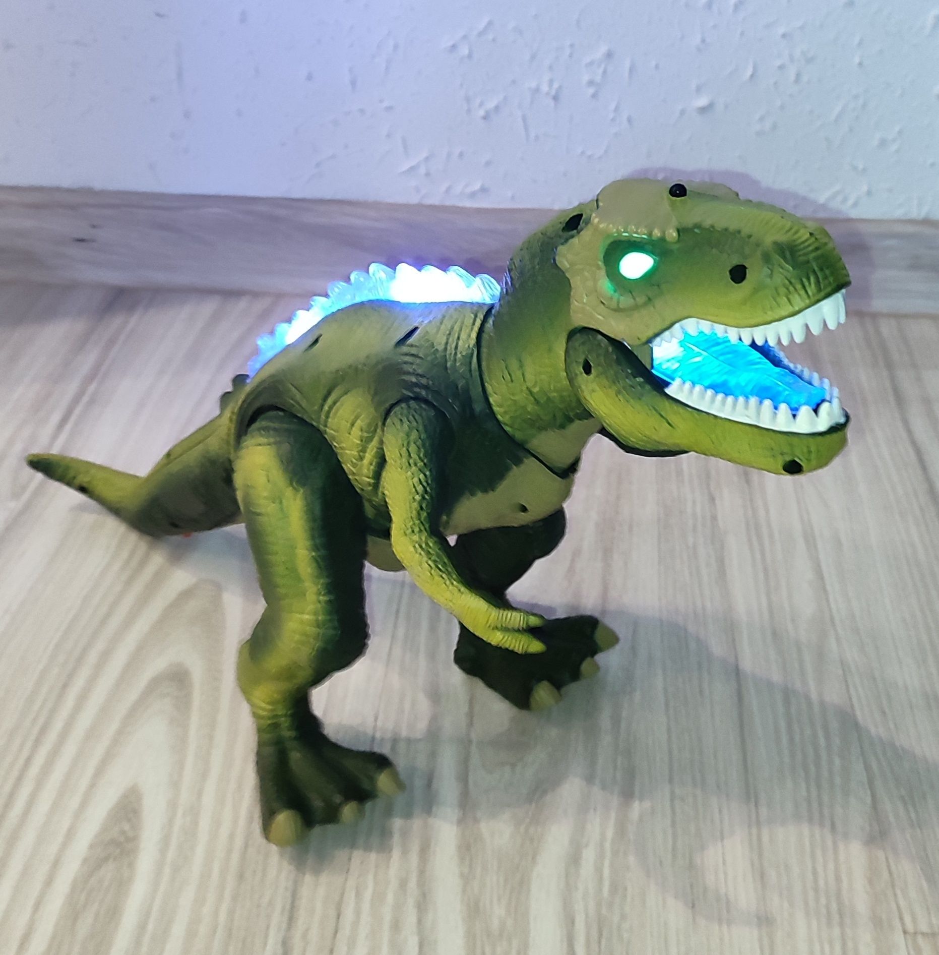 Dinozaur T - rex. Gra, świeci porusza się.