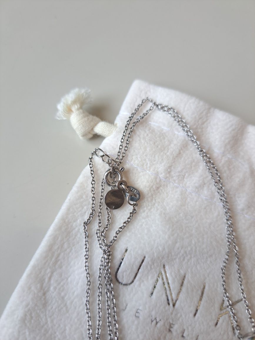 Colar Unike Jewellery - Prata 925, Pérola e Cristais
- Prata 925.
- Pi