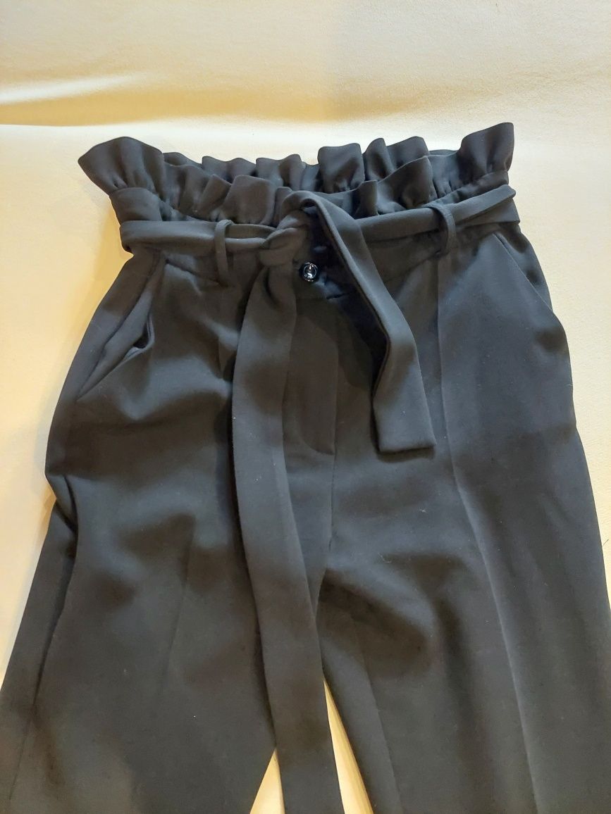 Eleganckie spodnie czarne m 38 wiązane w pasie
