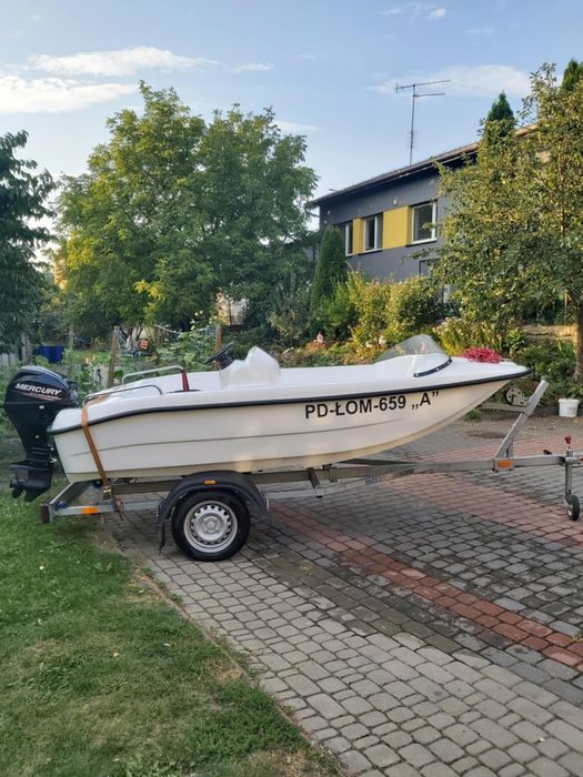 Łódź motorowa z przyczepą i silnikiem Mercury 10 KM