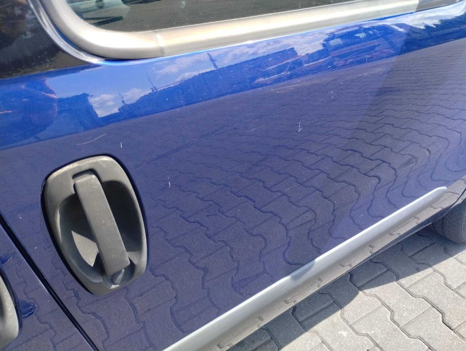 drzwi przód przednie prawe kompletne Fiat Doblo II Combo D 487