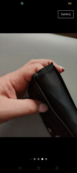 Nowy czarny portfel bez metki. Ślady od leżenia w szafie