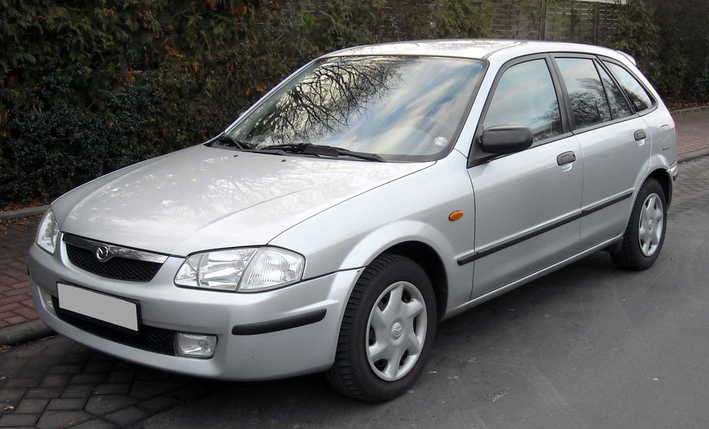 Розборка MAZDA 323 капот крило дверка фара коробка салон
