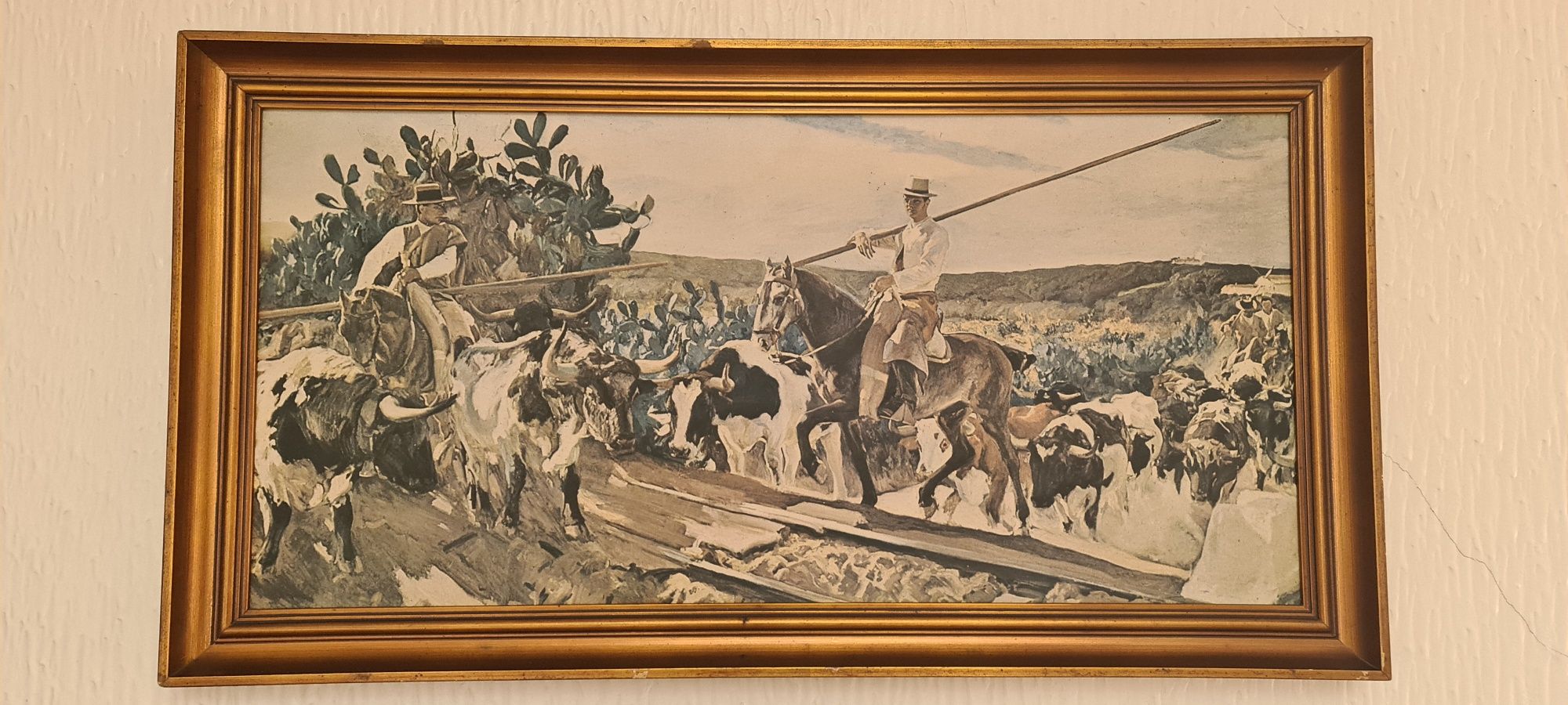 Quadro com vaqueiros.