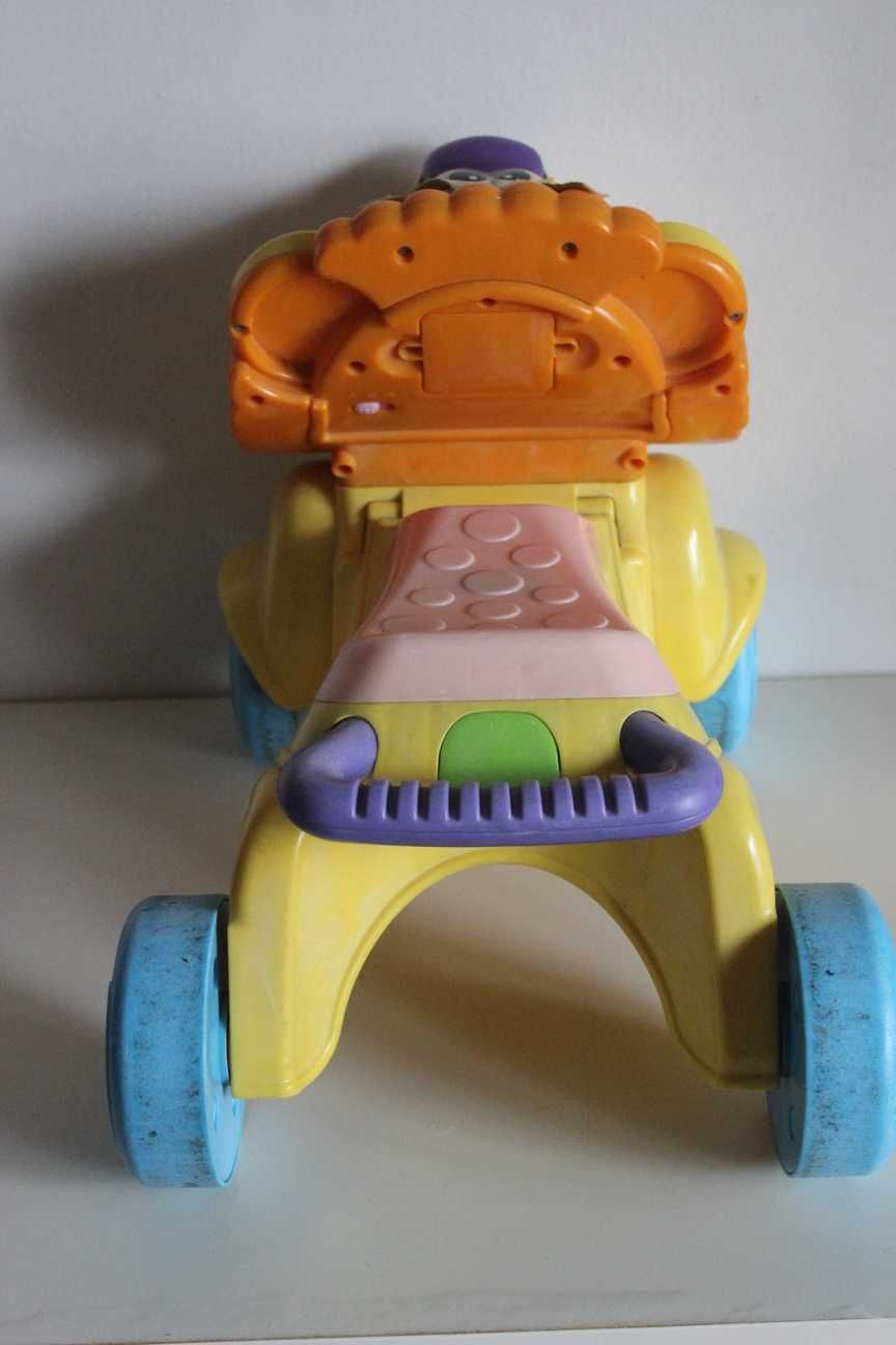 Fisher Price - Pchacz wózek jeździk grający lew