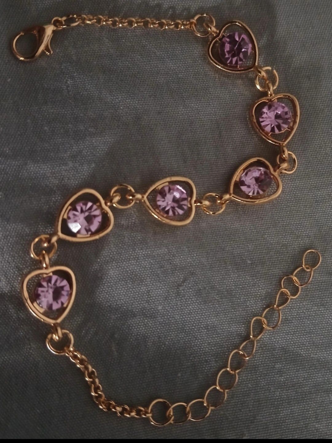 Pulseira dourada e roxa