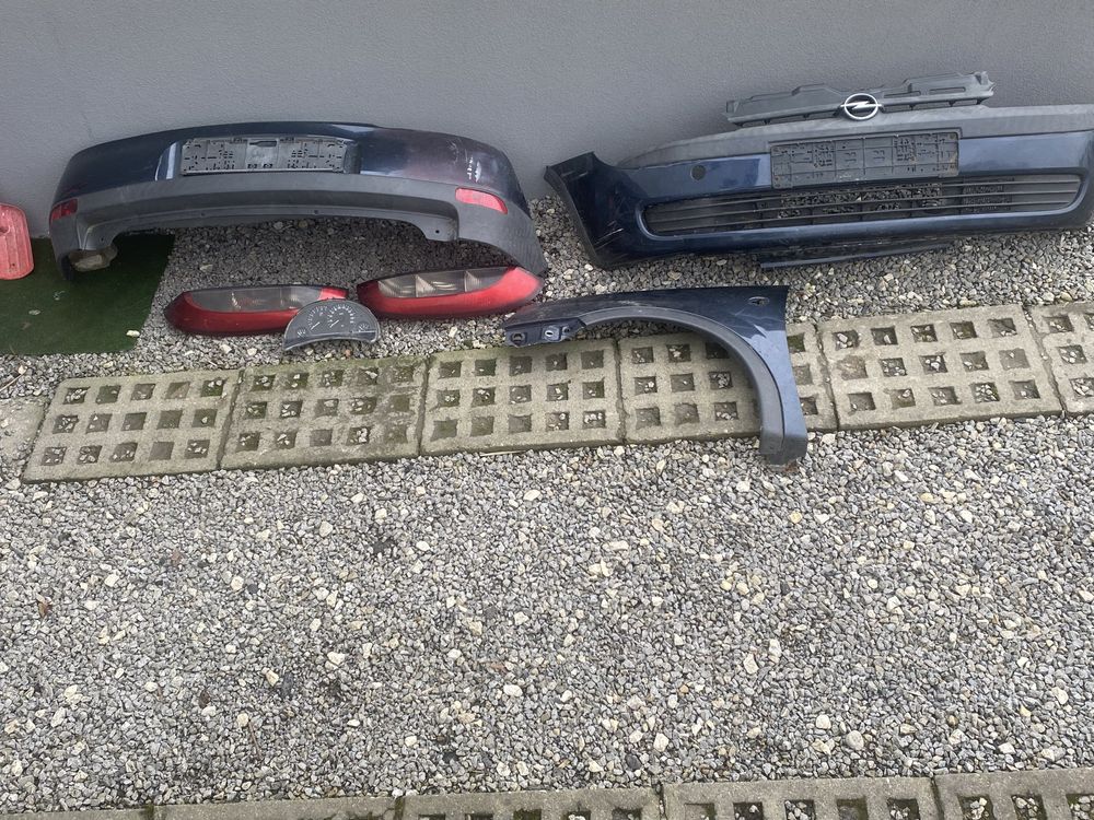 Opel Corsa C lampy, zderzak, blotnik, licznik