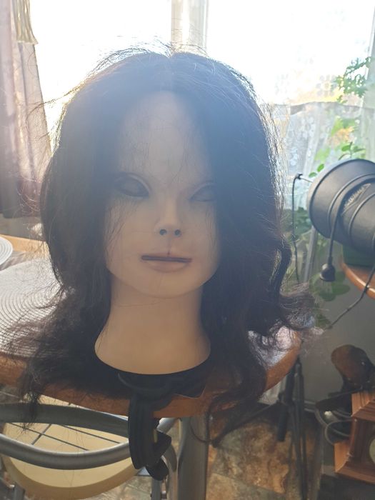 Glowa fryzjerska z uchwytem marki Calissimo.