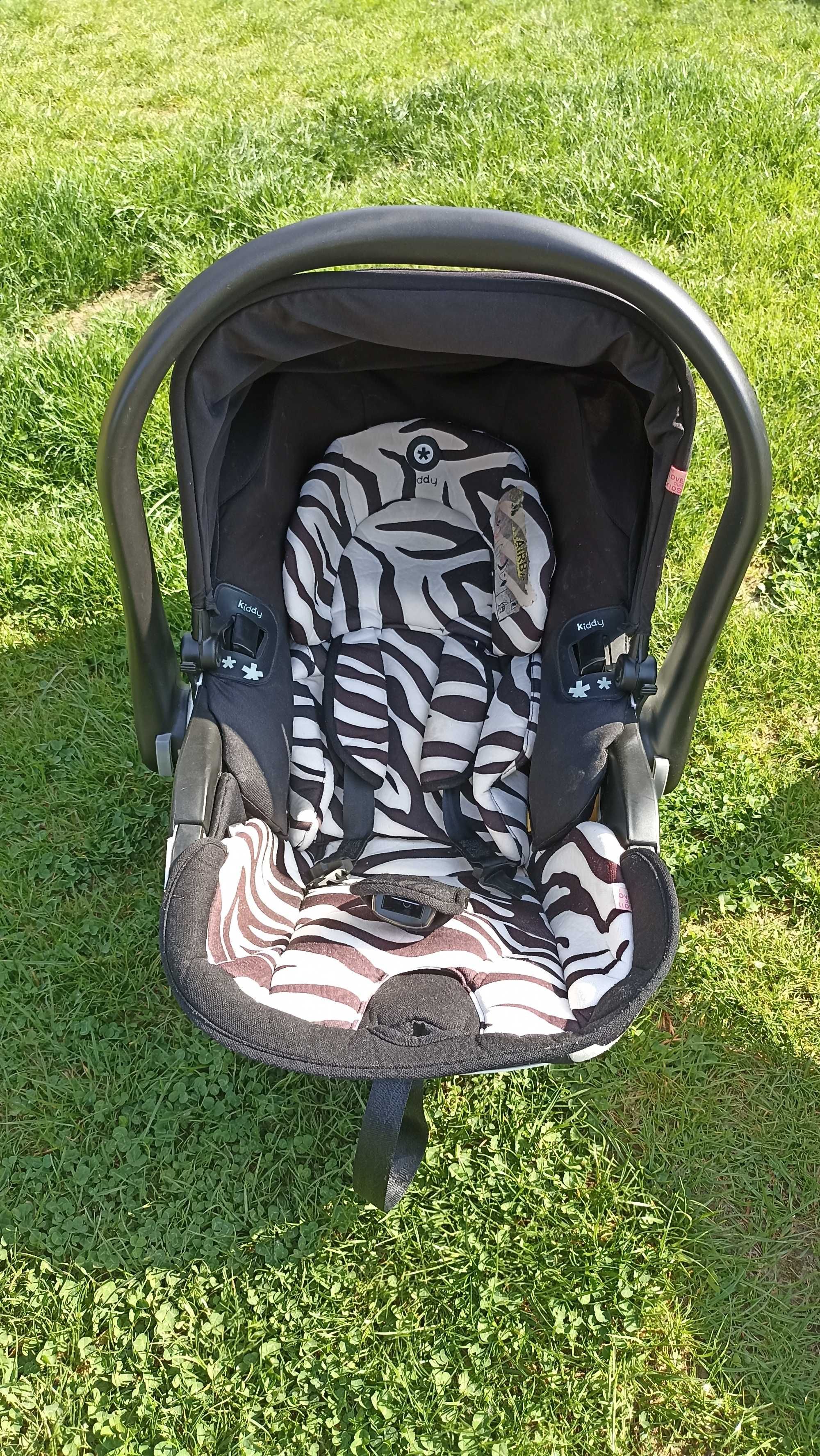 Fotelik kiddy evoluna i-size2 plus baza plus przejściówki do wozka
