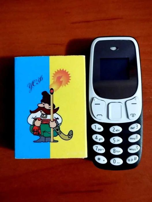 Малюк міні телефон.