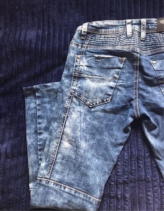 Niebieskie spodnie dżinsowe 29 na wiele guzików Denim