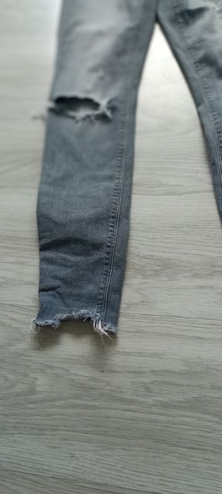 River Island spodnie dziewczęce szary jeans dziury przetarcia EU 34/8