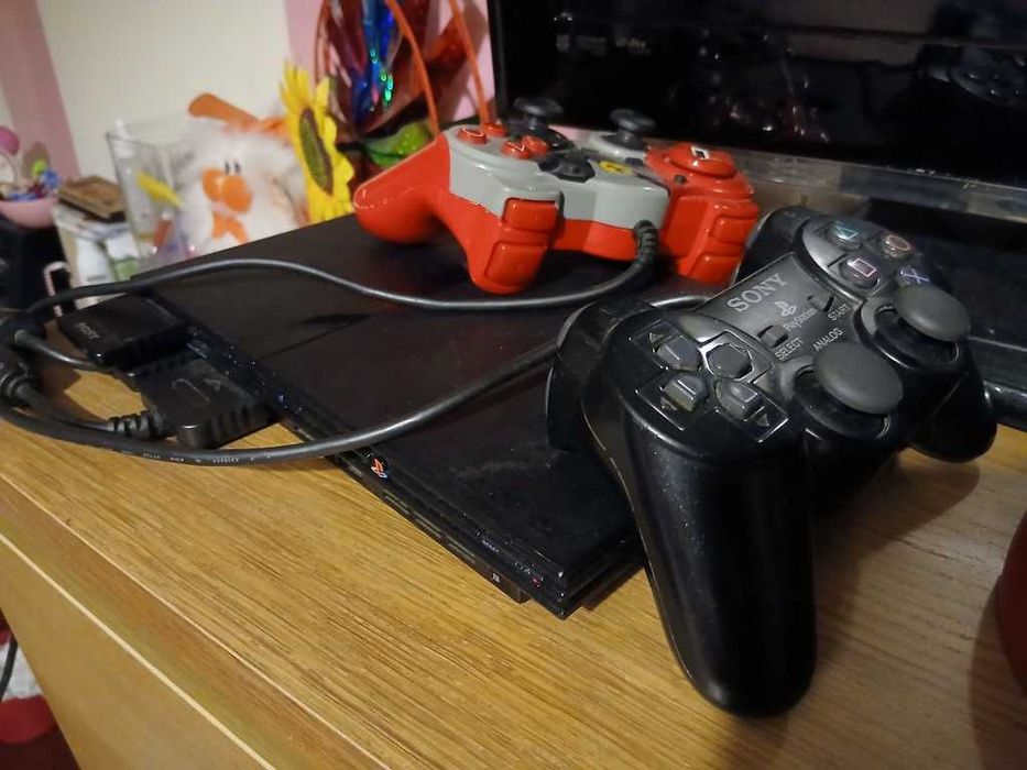 Ps2 Playstation 2 slim + 2 comandos + 20 jogos originais + c d memória
