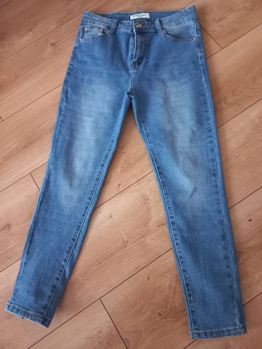 Spodnie jeansowe damskie z kokardkami