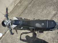 Mota 125 com alguns afazeres