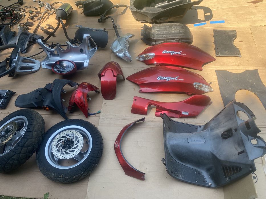 Kymco Grandink 125 owiewka licznik lampa koło zacisk amortyzator bak