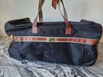 Torba podróżna na kółkach American Tourister.